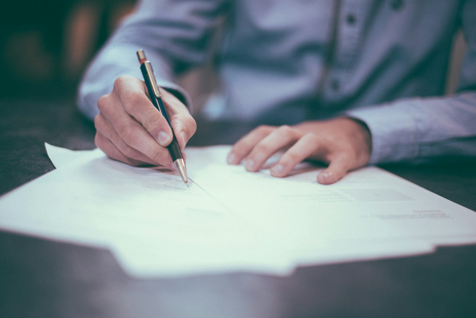 Person reviewing tax documents at a desk